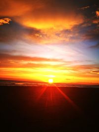 Scenic view of dramatic sky during sunset