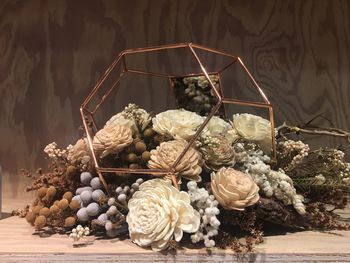 Close-up of flowers in basket on table