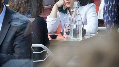 Woman sitting at restaurant table