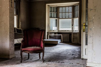 Empty chairs in abandoned house