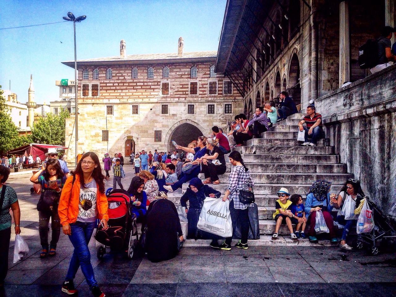 large group of people, architecture, building exterior, built structure, person, men, lifestyles, street, mixed age range, walking, leisure activity, city, crowd, city life, travel, history, day, market, cultures