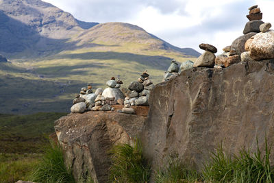 Rocks on mountain against sky