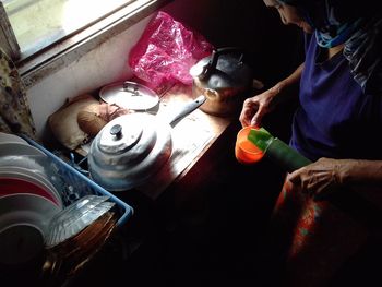High angle view of man preparing food on table