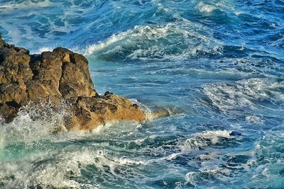 Waves splashing on rocks