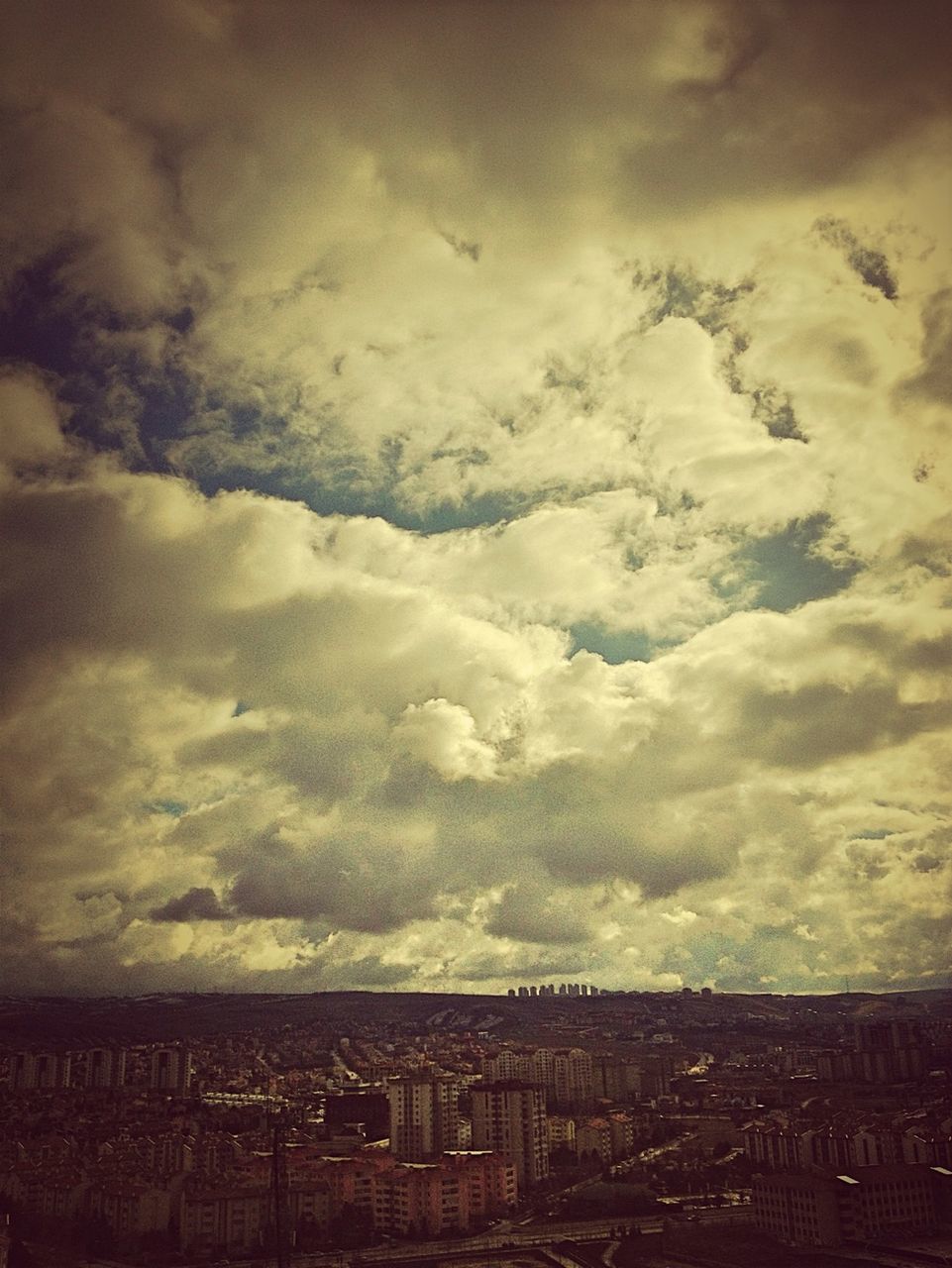 sky, cloud - sky, cloudy, architecture, built structure, weather, building exterior, overcast, cloud, landscape, nature, outdoors, tranquility, no people, scenics, tranquil scene, storm cloud, day, beauty in nature, low angle view