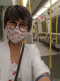 Portrait of woman sitting in train