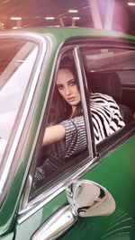 Portrait of woman sitting in car