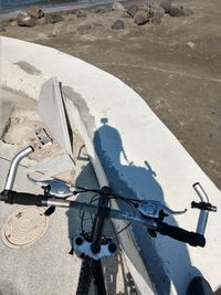 High angle view of bicycle parked on road