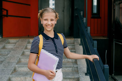 Portrait of young woman using mobile phone