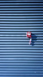 Fire alarm on corrugated wall