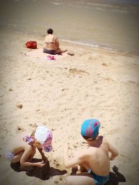 High angle view of children playing on beach