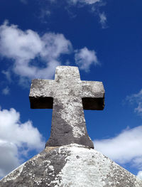 Low angle view of cross against the sky