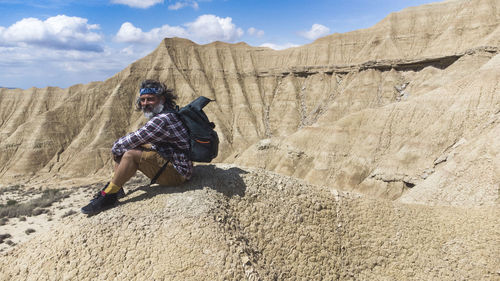 Rear view of man walking on mountain