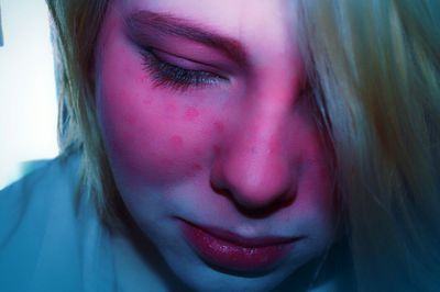 Close-up of sad young woman with face paint