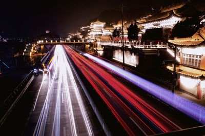 High angle view of light trails on road at night