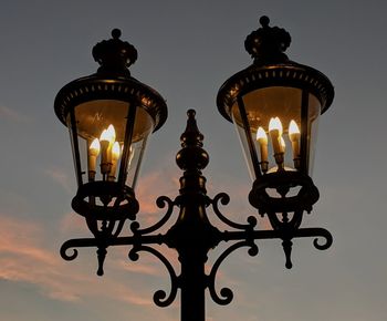Two old-fashioned lanterns at twilight