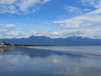 Scenic view of sea against blue sky