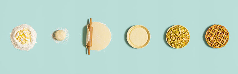 Directly above shot of cupcakes against white background