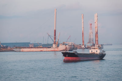 Ship in sea against sky