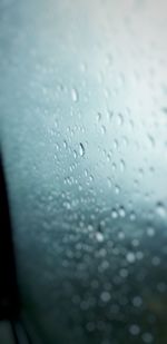 Close-up of raindrops on glass window