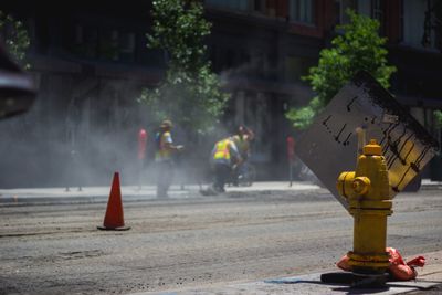 Traffic cones on road in city