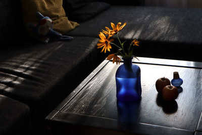 Close-up of flower vase on table at home