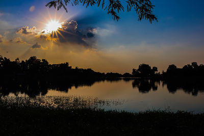 Scenic view of lake against sky during sunset