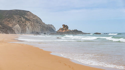 Scenic view of beach against sky