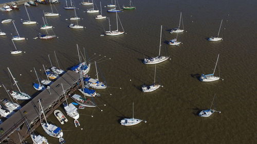 High angle view of boats moored in row