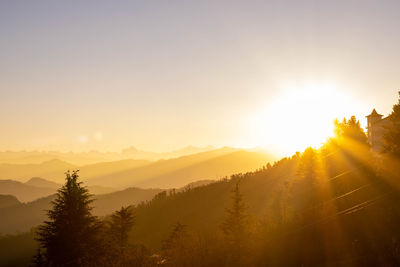 Scenic view of mountains against sky during sunset