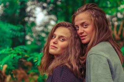 Portrait of smiling young couple outdoors