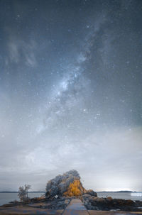Scenic view of sea against sky at night