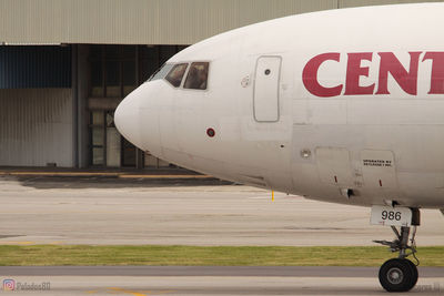 Close-up of airplane on airport runway