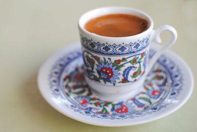 Close-up of coffee cup on table