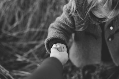 Close-up of woman holding hands