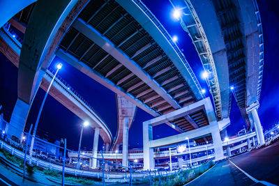 Low angle view of modern buildings in city at night