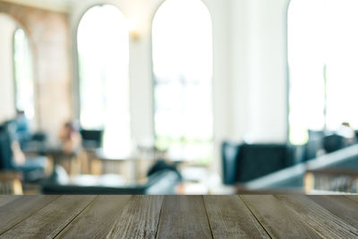 Close-up of wooden table in building