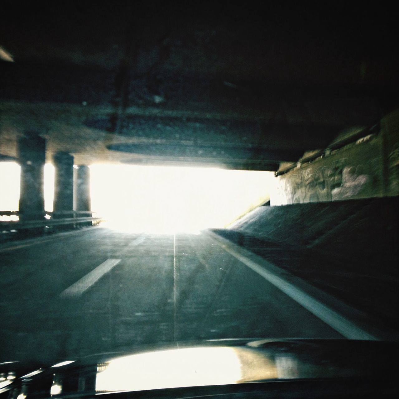 transportation, mode of transport, land vehicle, the way forward, road, car, bridge - man made structure, diminishing perspective, indoors, windshield, built structure, sunlight, road marking, travel, vanishing point, connection, railing, architecture, vehicle interior, street