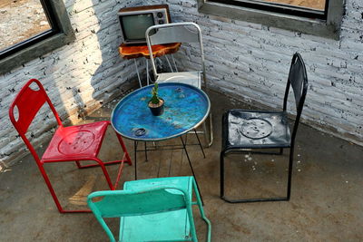 High angle view of empty chairs on table