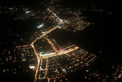 Aerial view of illuminated cityscape at night