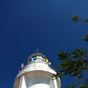 Low angle view of tower against clear blue sky