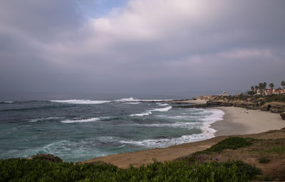 Scenic view of sea against cloudy sky