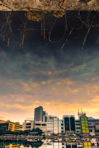 Low angle view of buildings against sky during sunset