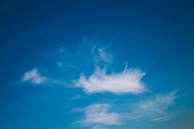 Low angle view of blue sky on sunny day