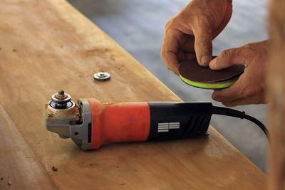 Cropped hands of man working on table