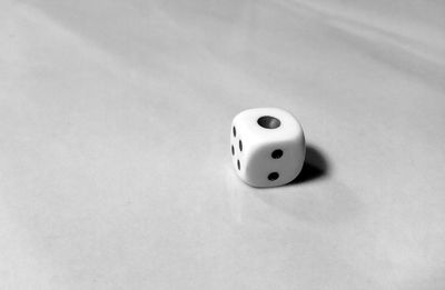 High angle view of piano on table against white background