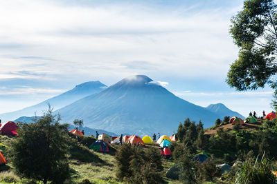 The view from the top of mount prau and the activities of the climbers near the camping tent