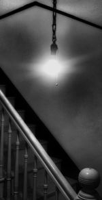 Low angle view of illuminated electric lamp