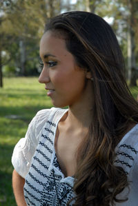 Portrait of a beautiful young woman looking away