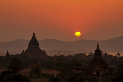 Pagoda against sky during sunset